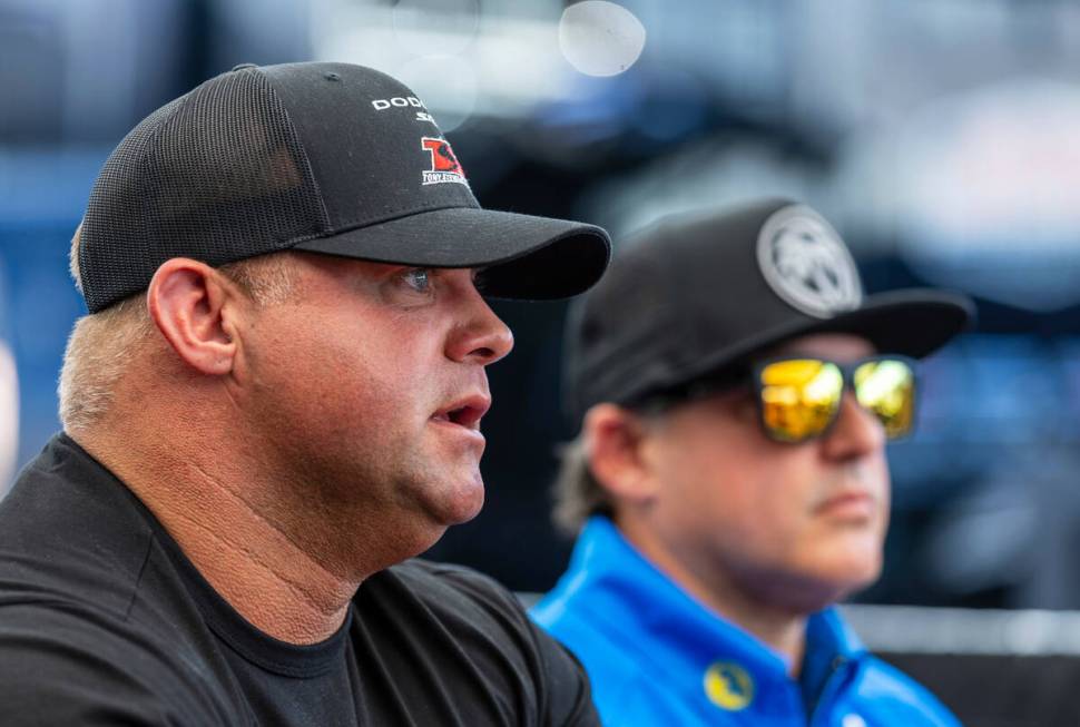 Funny Car racer Matt Hagan speaks as he and Top Fuel racer Tony Stewart talk with the media in ...