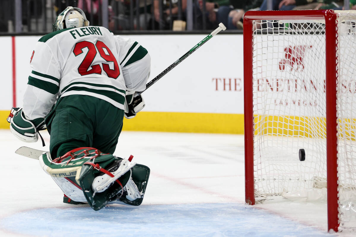 The puck soars into the net past Wild goaltender Marc-Andre Fleury (29) during the first period ...
