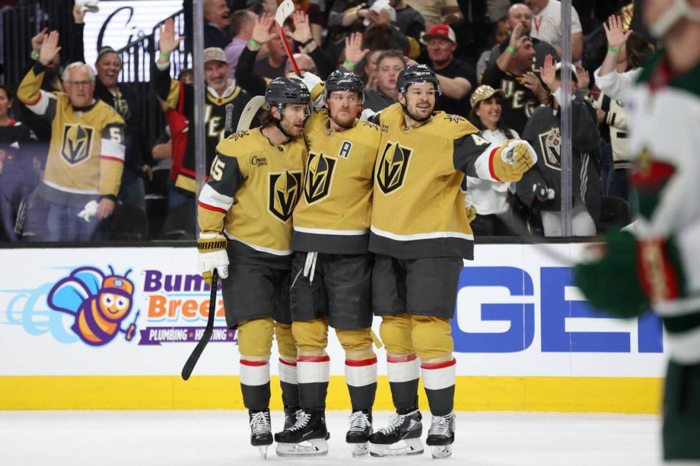 Golden Knights defenseman Noah Hanifin (15), center Jack Eichel (9) and center Tomas Hertl (48) ...