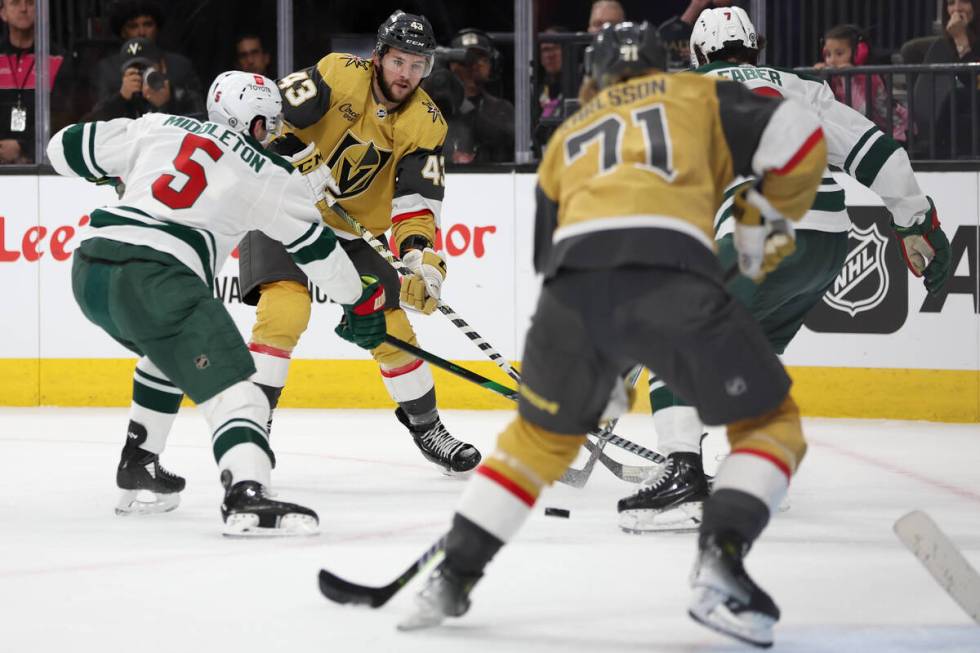 Golden Knights center Paul Cotter (43) passes the puck to center William Karlsson (71) before h ...