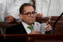 Rep. Jerrold Nadler, D-N.Y., reads a pocket copy of the U.S. Constitution as he waits for the a ...