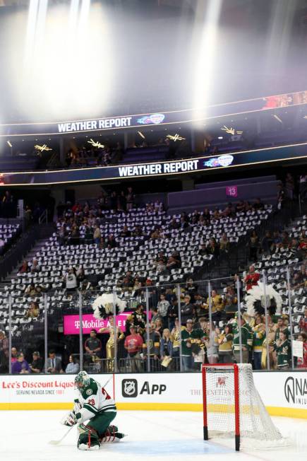 Wild goaltender Marc-Andre Fleury (29) takes shots during warmups before an NHL hockey game aga ...