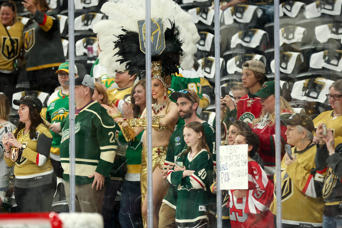 Golden Knights and Wild fans cheer for Wild goaltender Marc-Andre Fleury (29) as he takes the i ...