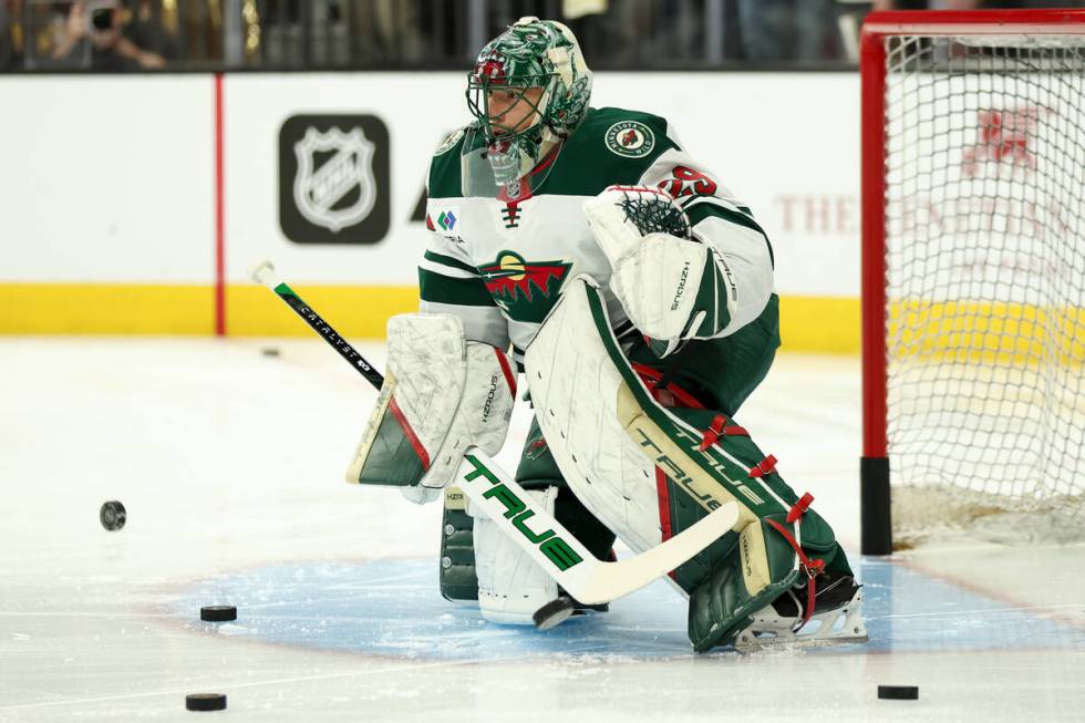 Wild goaltender Marc-Andre Fleury (29) watches the action during warmups before an NHL hockey g ...