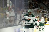 Wild goaltender Marc-Andre Fleury (29) skates past fans holding signs with his name during warm ...