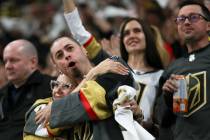 Golden Knights fans celebrate a goal during the second period before an NHL hockey game against ...