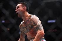 Max Holloway celebrates after knocking out Justin Gaethje during a UFC 300 mixed martial arts l ...