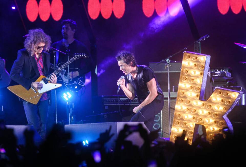 Brandon Flowers, right, and Dave Keuning perform with The Killers during a surprise appearance ...