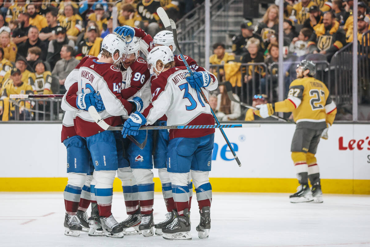 Colorado Avalanche players celebrate a goal during an NHL hockey game between the Golden Knight ...