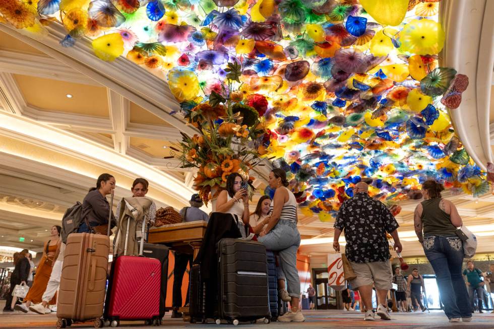 Guests wait in the lobby at Bellagio on Friday, Sept. 15, 2023, in Las Vegas. (Ellen Schmidt/La ...