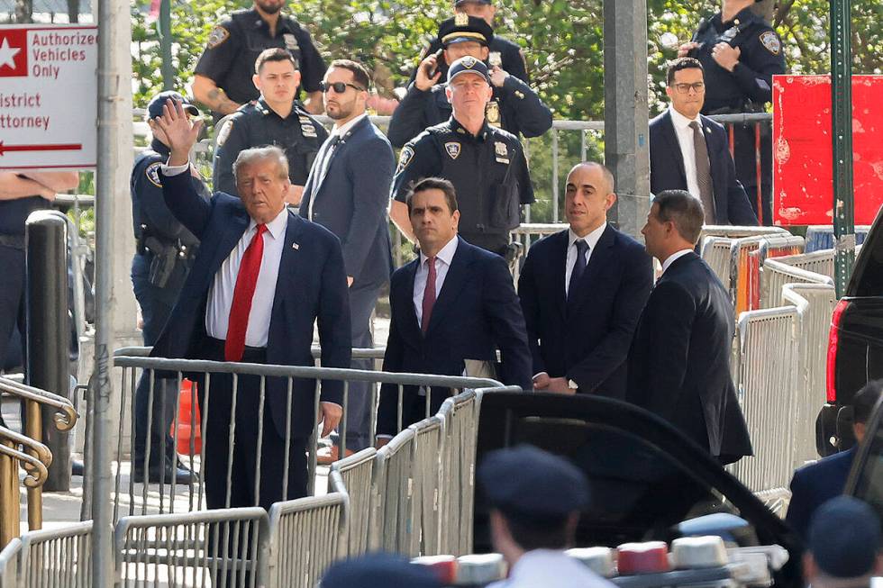 Former President Donald Trump arrives at Manhattan criminal court with his legal team, Monday, ...