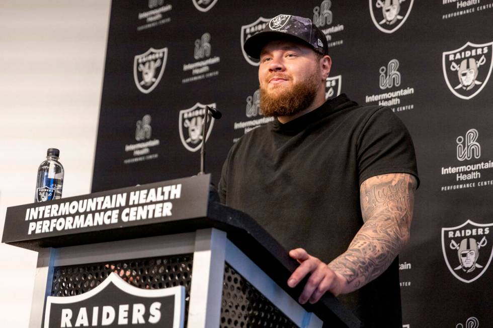 Raiders center Andre James takes questions during a media availability on the first day of thei ...