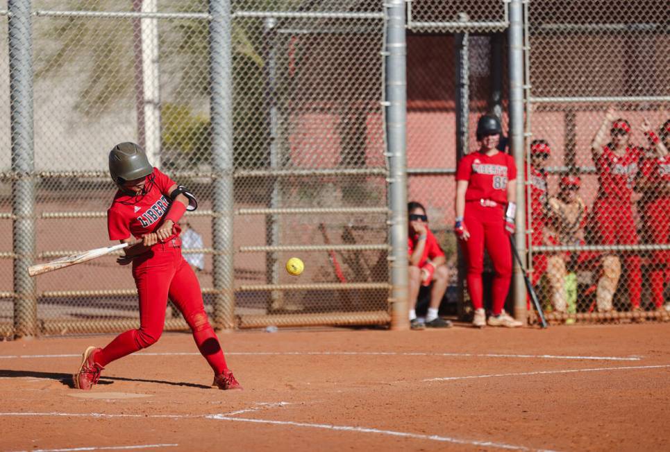 Liberty High School’s Jaydah Chun (50) bats against Centennial High School at the Majest ...