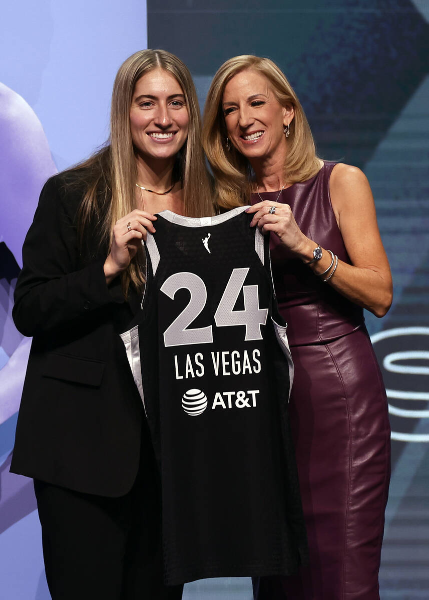 Iowa's Kate Martin, left, poses for a photo with WNBA commissioner Cathy Engelbert, right, afte ...