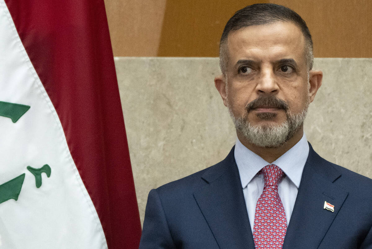 Iraq's Deputy Prime Minister Muhammad Ali Tamim listens as Secretary of State Antony Blinken sp ...