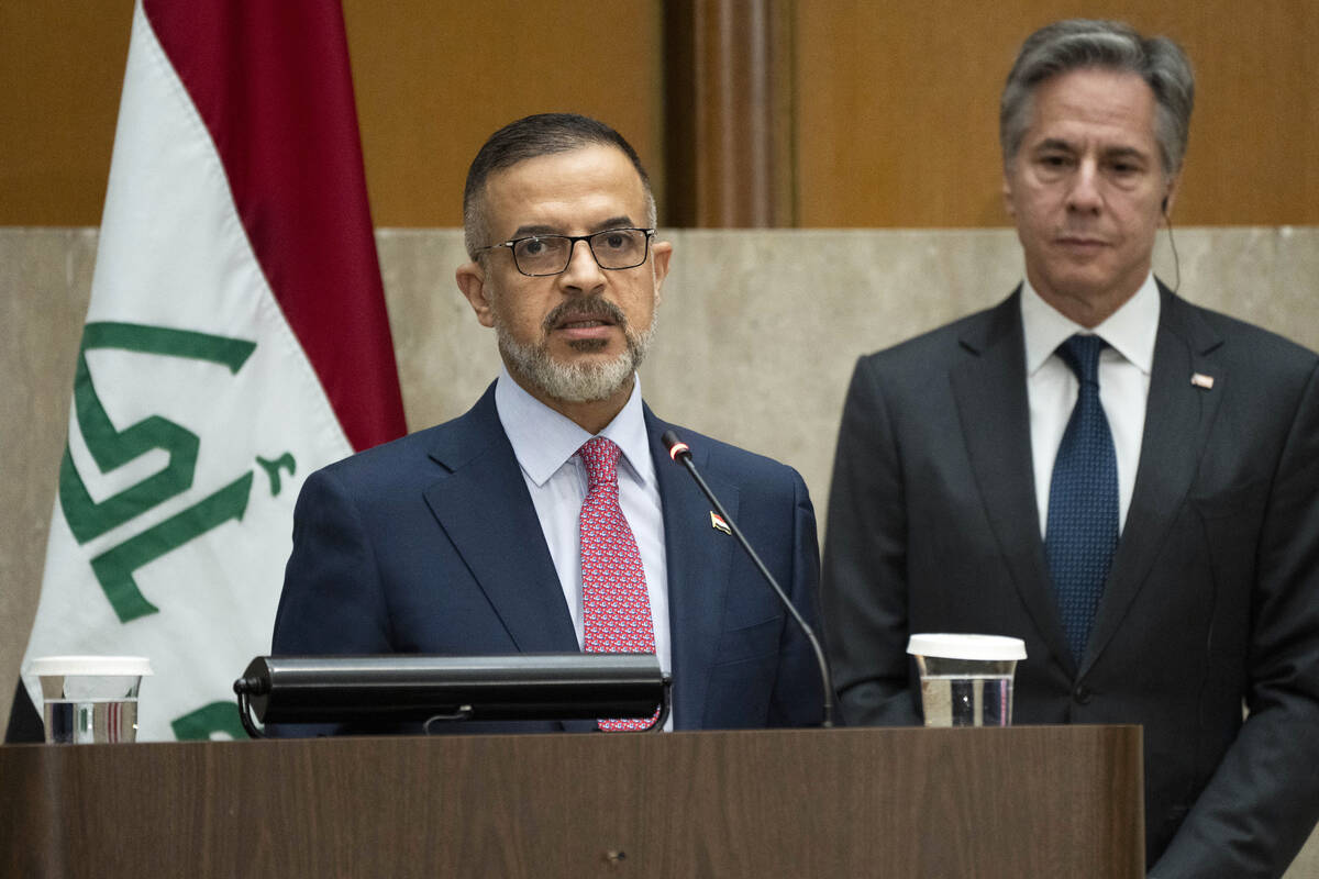 Iraq's Deputy Prime Minister Muhammad Ali Tamim speaks as Secretary of State Antony Blinken lis ...