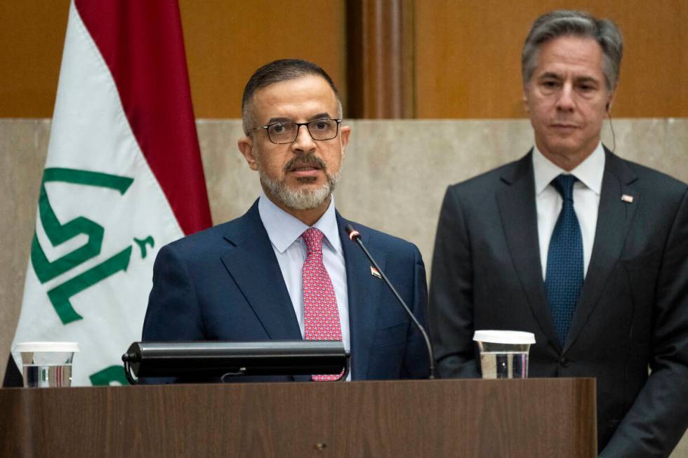 Iraq's Deputy Prime Minister Muhammad Ali Tamim speaks as Secretary of State Antony Blinken lis ...