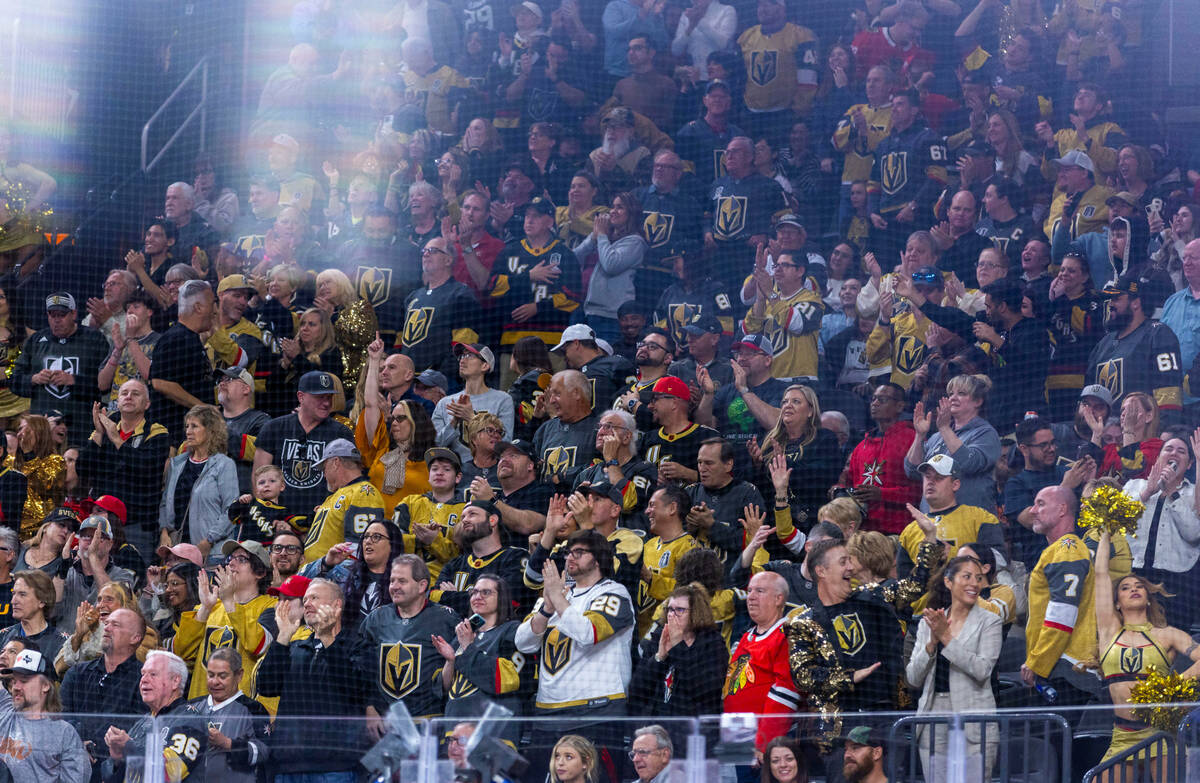 Golden Knights fans celebrate a goal against the Chicago Blackhawks during the second period of ...