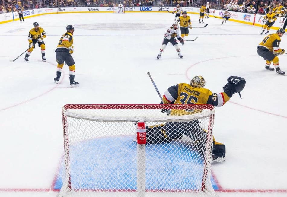 Golden Knights goaltender Logan Thompson (36) saves a shot by the Chicago Blackhawks during the ...