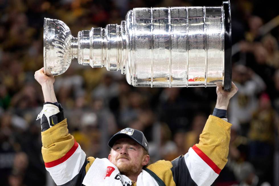 Golden Knights center Jack Eichel (9) celebrates with the Stanley Cup after winning the NHL hoc ...