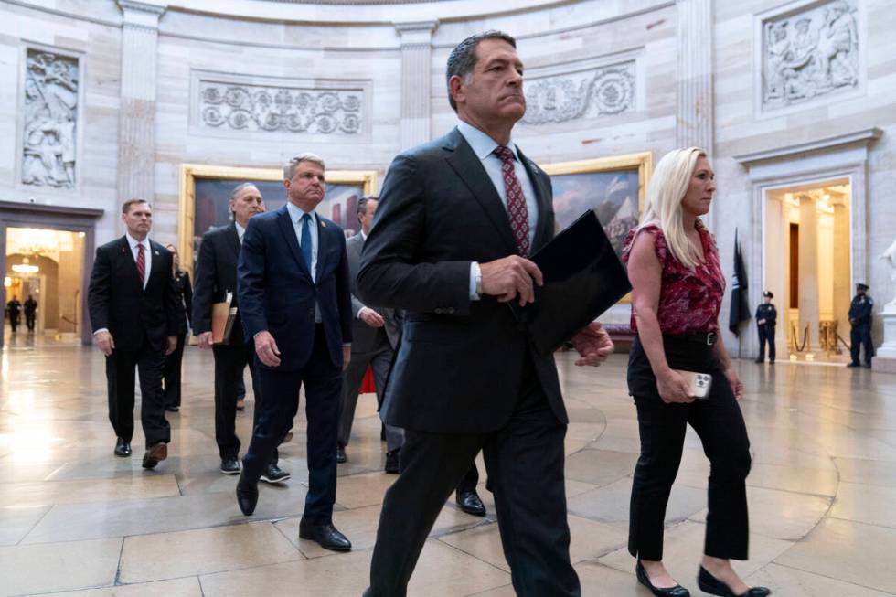 House Impeachment Managers from left, Rep. Michael Guest, R-Miss., Rep. Andy Biggs, R-Ariz., Ho ...