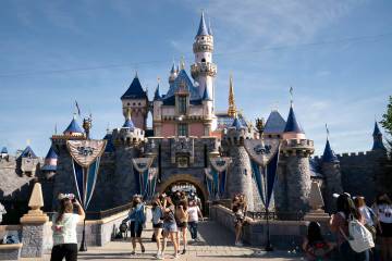 Visitors pass through Disneyland in Anaheim, Calif., April 30, 2021. (AP Photo/Jae C. Hong, File)