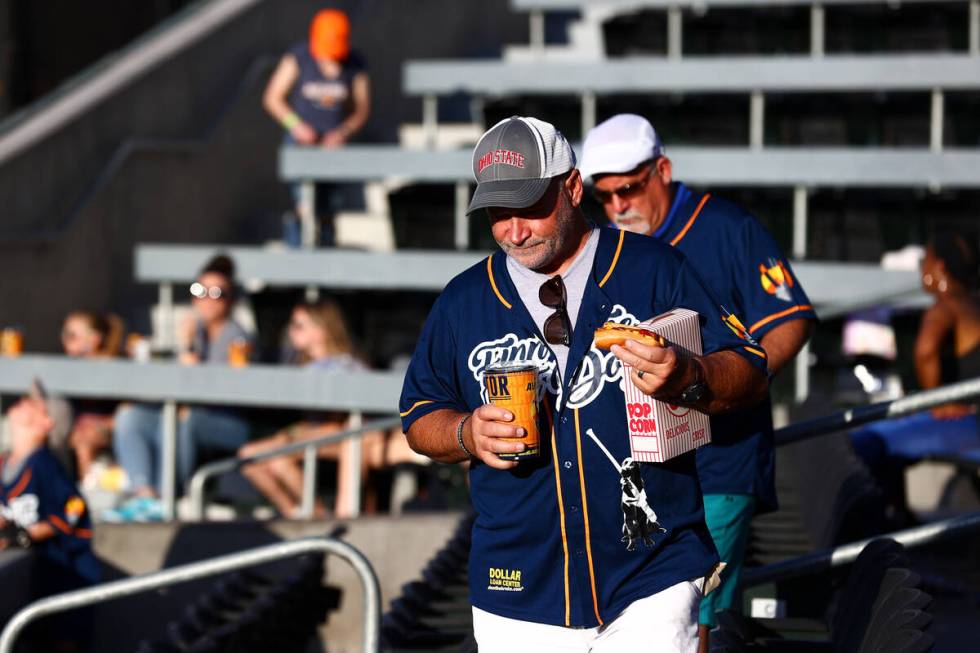 Fans wear Finn the Bat Dog jerseys to honor the Las Vegas Aviators’ long-time bat retrie ...