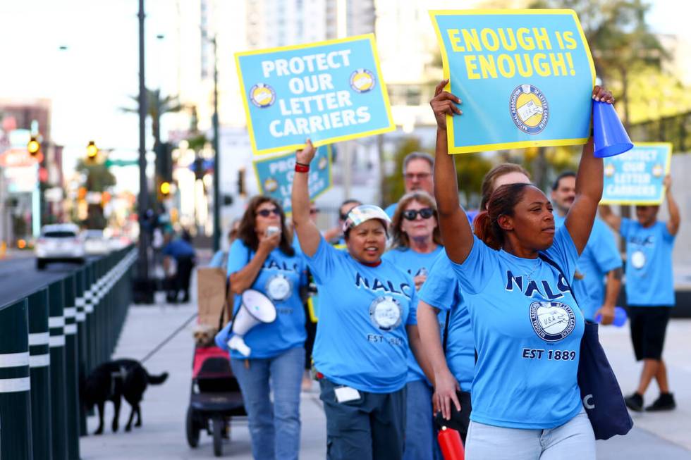 Postal workers protest during a National Association of Letter Carriers rally outside the Lloyd ...