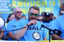 Brian Renfroe, president of the National Association of Letter Carriers union, speaks during a ...