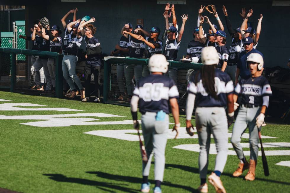 Shadow Ridge players celebrate during an baseball game between Bishop Gorman and Shadow Ridge a ...