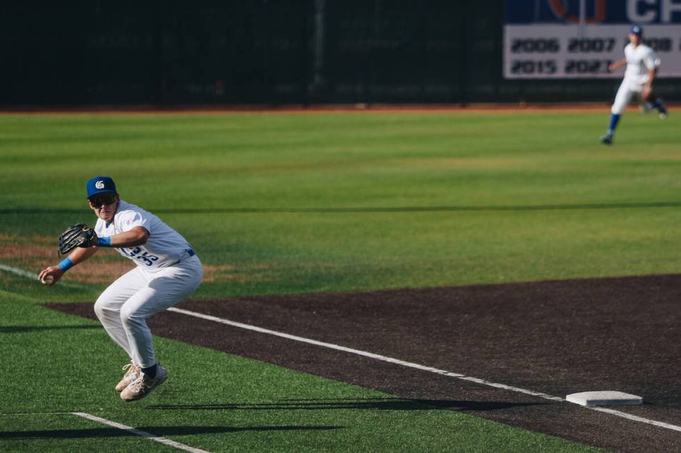 Bishop Gorman catcher Ryan Hunter (35) throws the ball to a teammate during an baseball game be ...