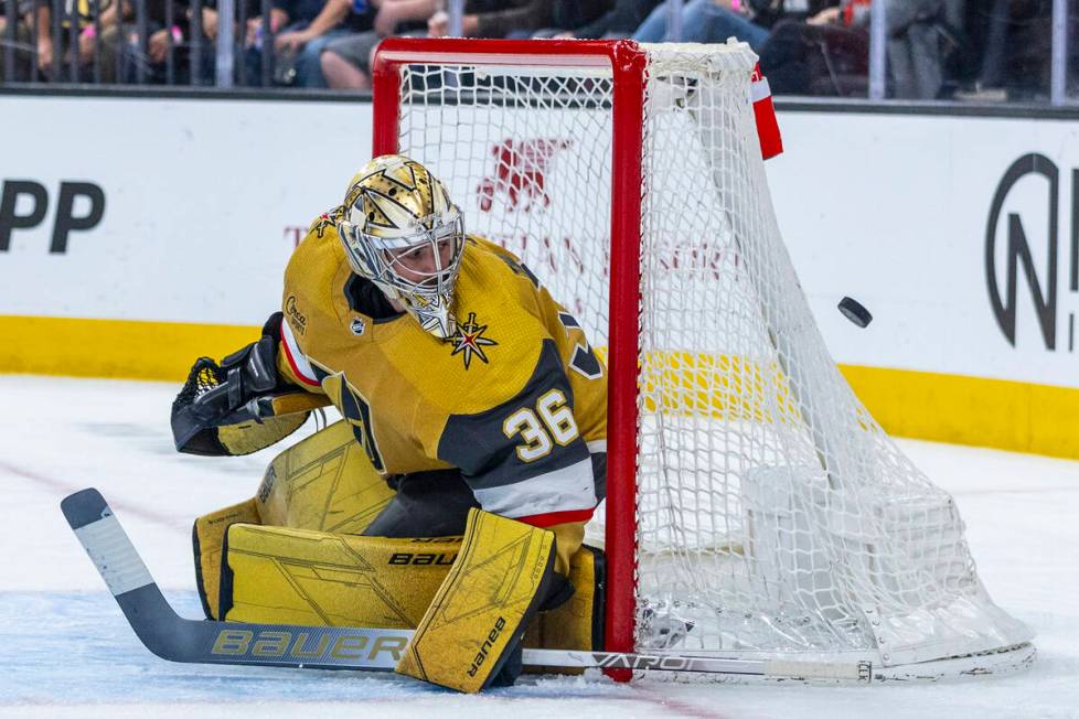 Golden Knights goaltender Logan Thompson (36) eyes a puck coming his way from the Chicago Black ...