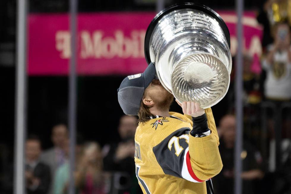 Golden Knights center William Karlsson (71) kisses the Stanley Cup after winning the NHL hockey ...