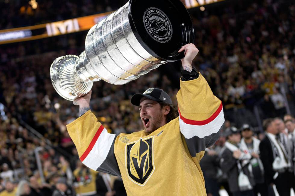 Golden Knights goaltender Logan Thompson (36) celebrates with the Stanley Cup after winning the ...