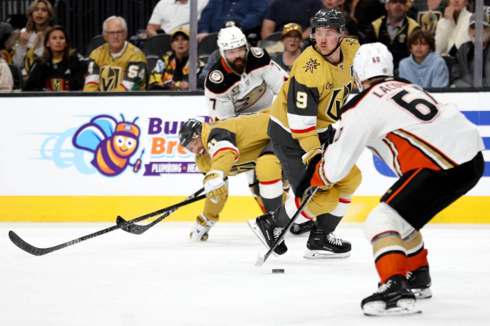 Golden Knights center Jack Eichel (9) skates with the puck against Ducks defenseman Jackson LaC ...