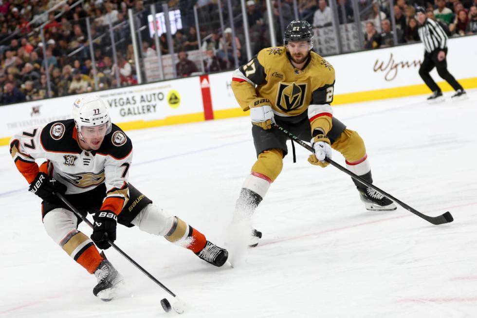 Ducks right wing Frank Vatrano (77) skates with the puck against Golden Knights defenseman Shea ...