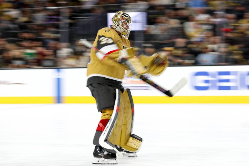 Golden Knights goaltender Adin Hill (33) skates to the net during the second period of an NHL h ...