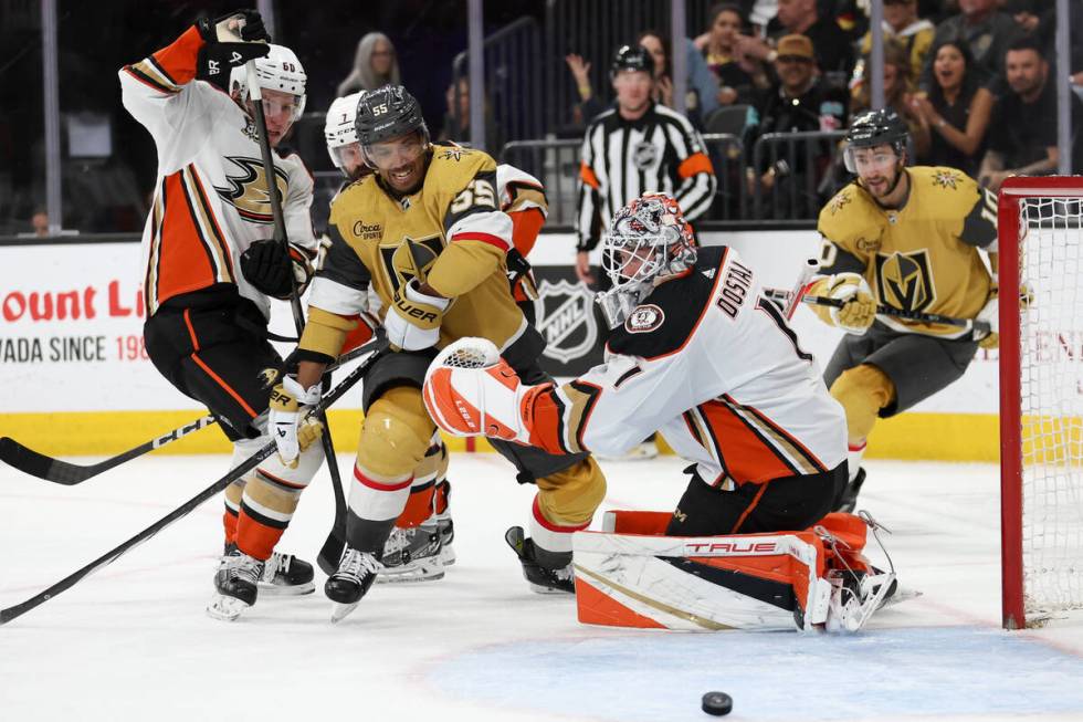 Golden Knights right wing Keegan Kolesar (55) charges toward the puck after Ducks goaltender Lu ...