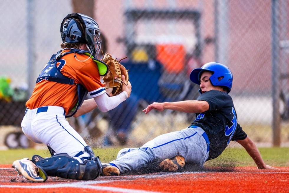 Sierra Vista batter Owen Angelo (30) slides home safely after a late throw to Legacy catcher Za ...