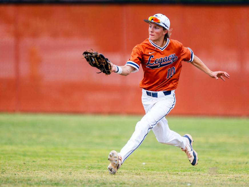 Legacy outfielder Tyson Lake (10) runs down a fly ball against a Sierra Vista batter during the ...