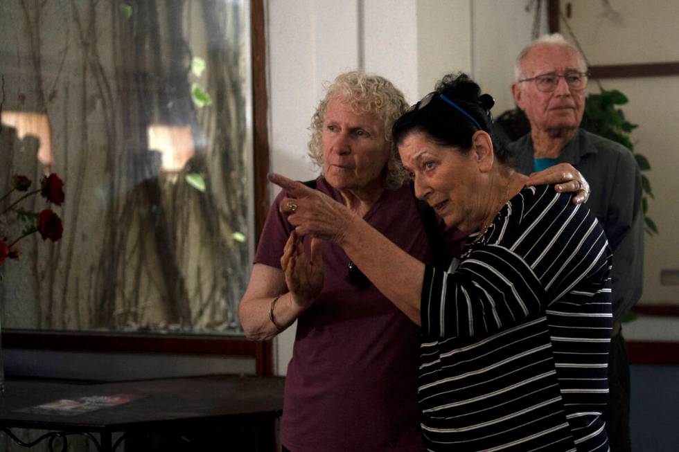 Osnat Peri, right, whose husband, Haim, is in Hamas captivity, takes part in a Passover Seder c ...