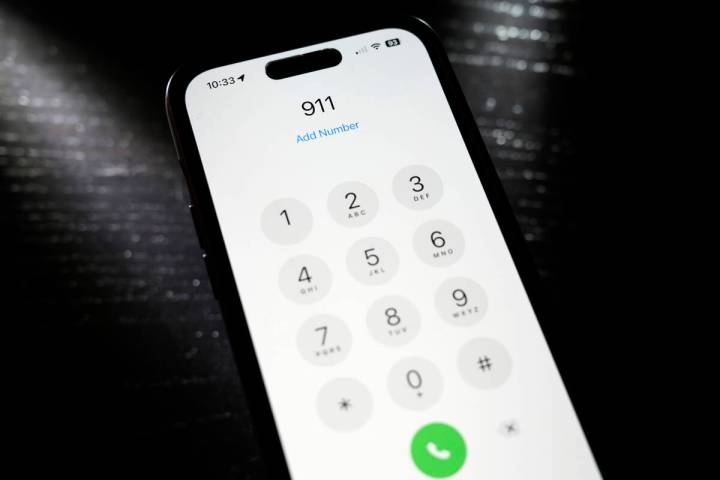 Emergency 911 number is dialed on a mobile phone, Thursday, April 18, 2024, in St. Louis. Law e ...