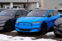 Mustang Mach-E electric 2024 vehicles are displayed at a Ford dealership Sunday, Jan. 21, 2024, ...