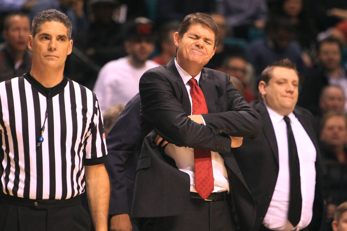 UNLV head coach Dave Rice winces after an offensive Rebel foul during their MGM Grand Showcase ...