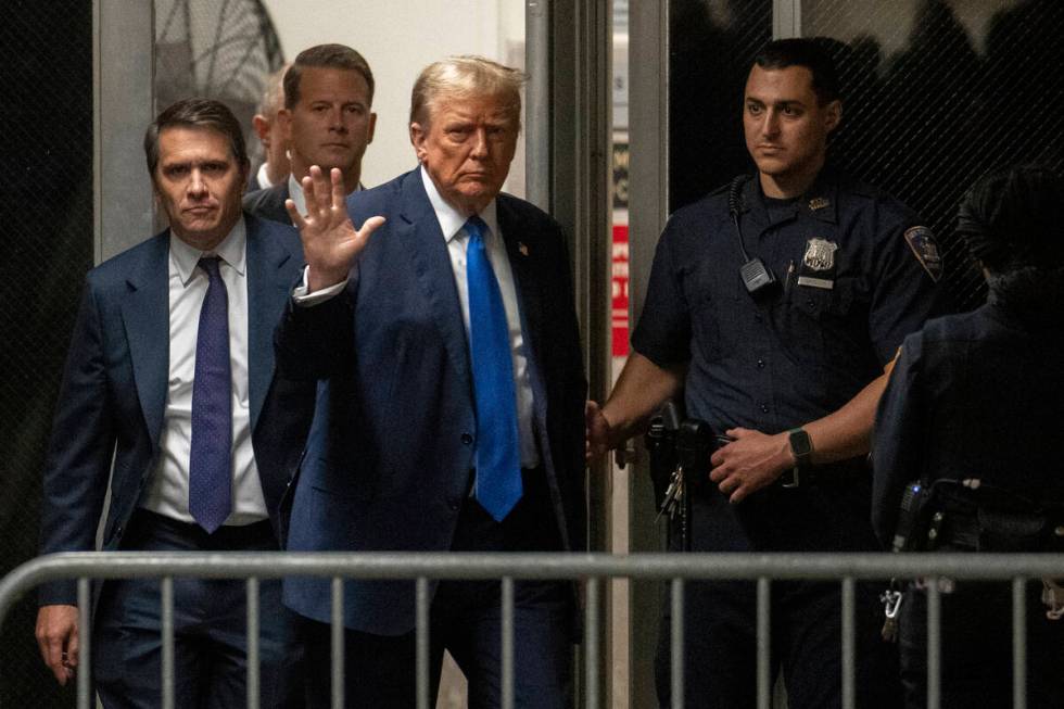 Former President Donald Trump returns from a break at Manhattan criminal court in New York on T ...