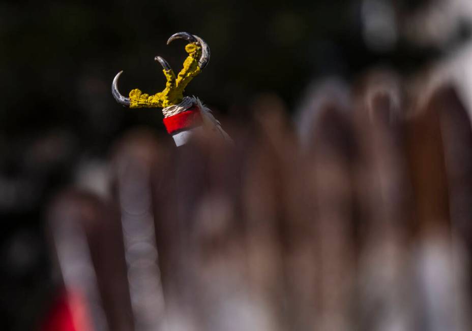 Dancer Tyrell Phillips, 14, with the Dine tribe from Phoenix, carries his family's eagle staff ...