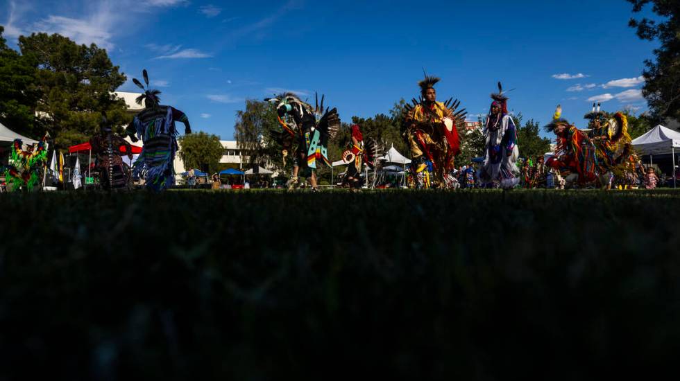 Dancers move about the grounds while performing for the crowd during the Powwow for the Planet ...