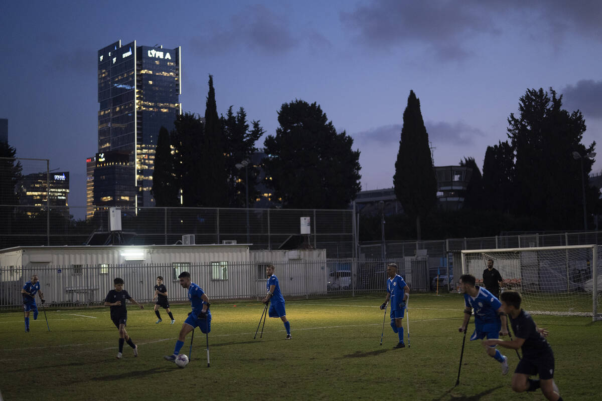 Israel Amputee Football Team soccer players take part in a practice session with young players ...