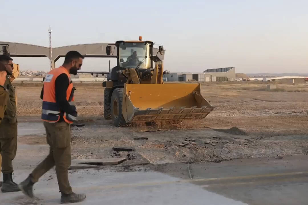 This still from an undated handout video released by the Israeli military shows workers trying ...