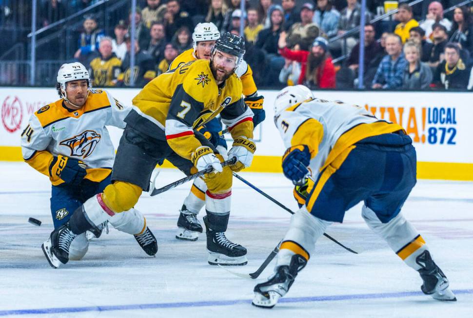 Golden Knights defenseman Alex Pietrangelo (7) looks to the puck in traffic while facing Nashvi ...